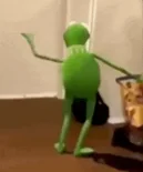 Kermit the Frog dancing with arms outstretched.